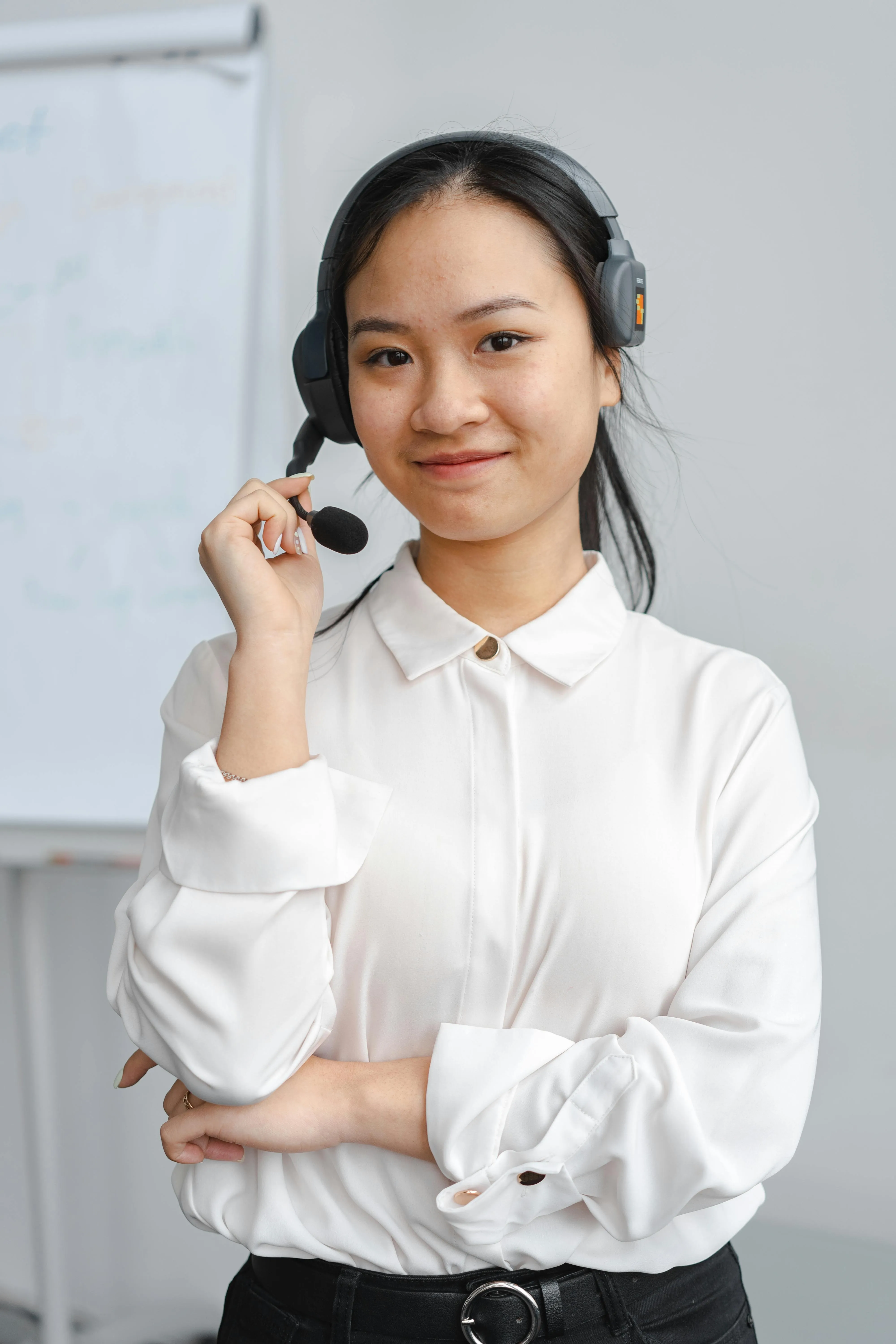 Female student smiling and carrying a backpack, actively engaged in learning activities